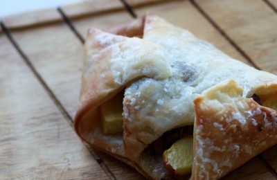 apple granola breakfast pastry on a wooden tray