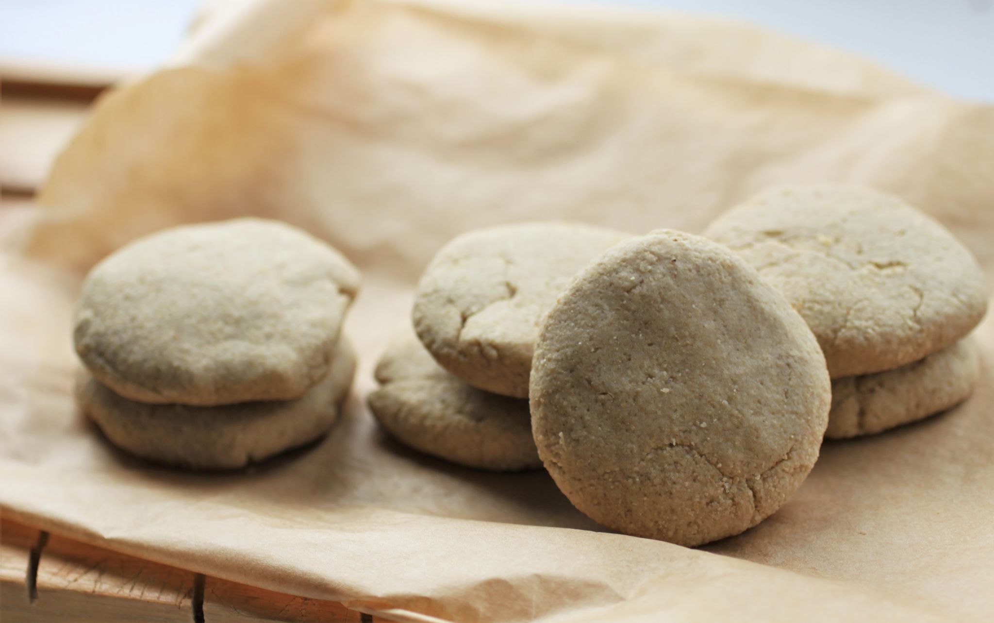 Vegan oat biscuits spread out on a tray