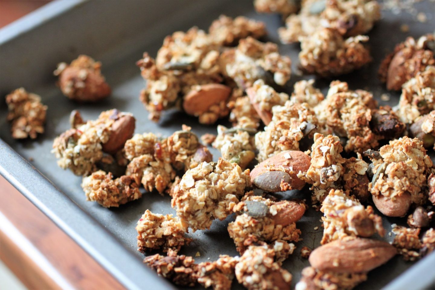 refined sugar free nutty granola on a baking tray
