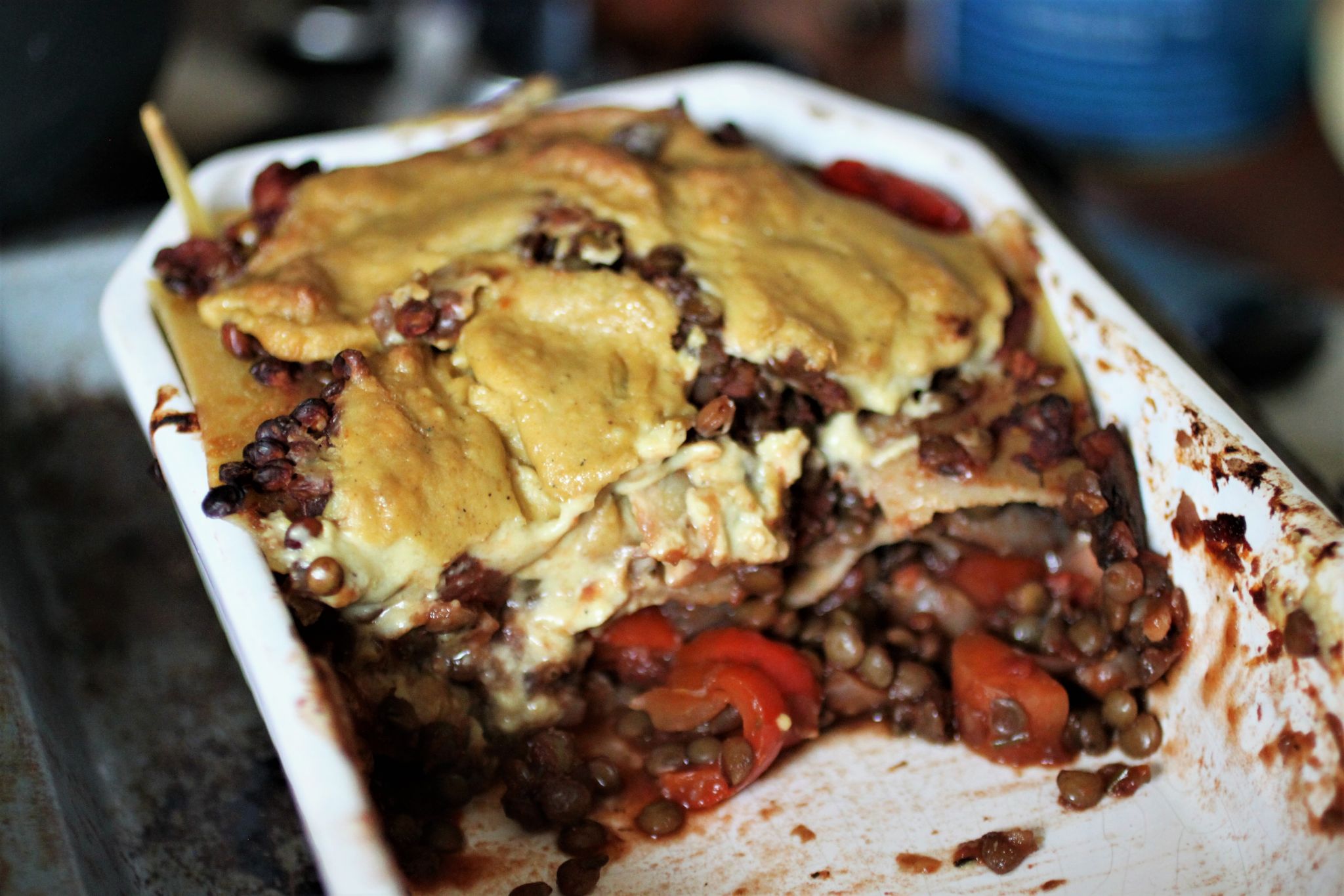 vegan lasagne dish, baked, with a few slices taken out