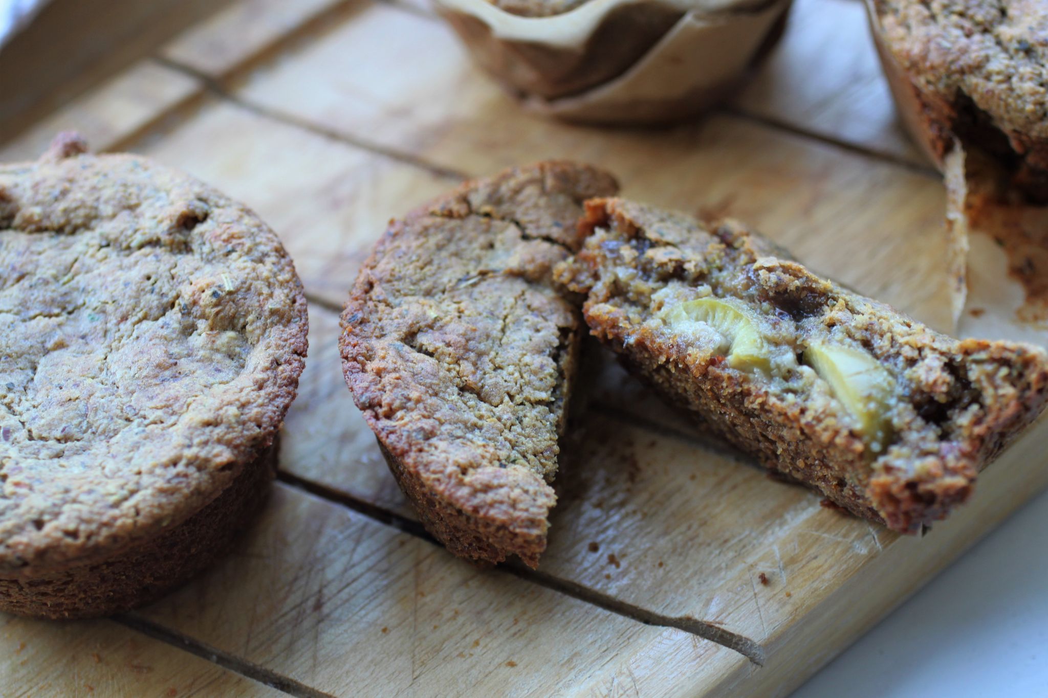 muffin cut open to see the olives and jammy onion inside