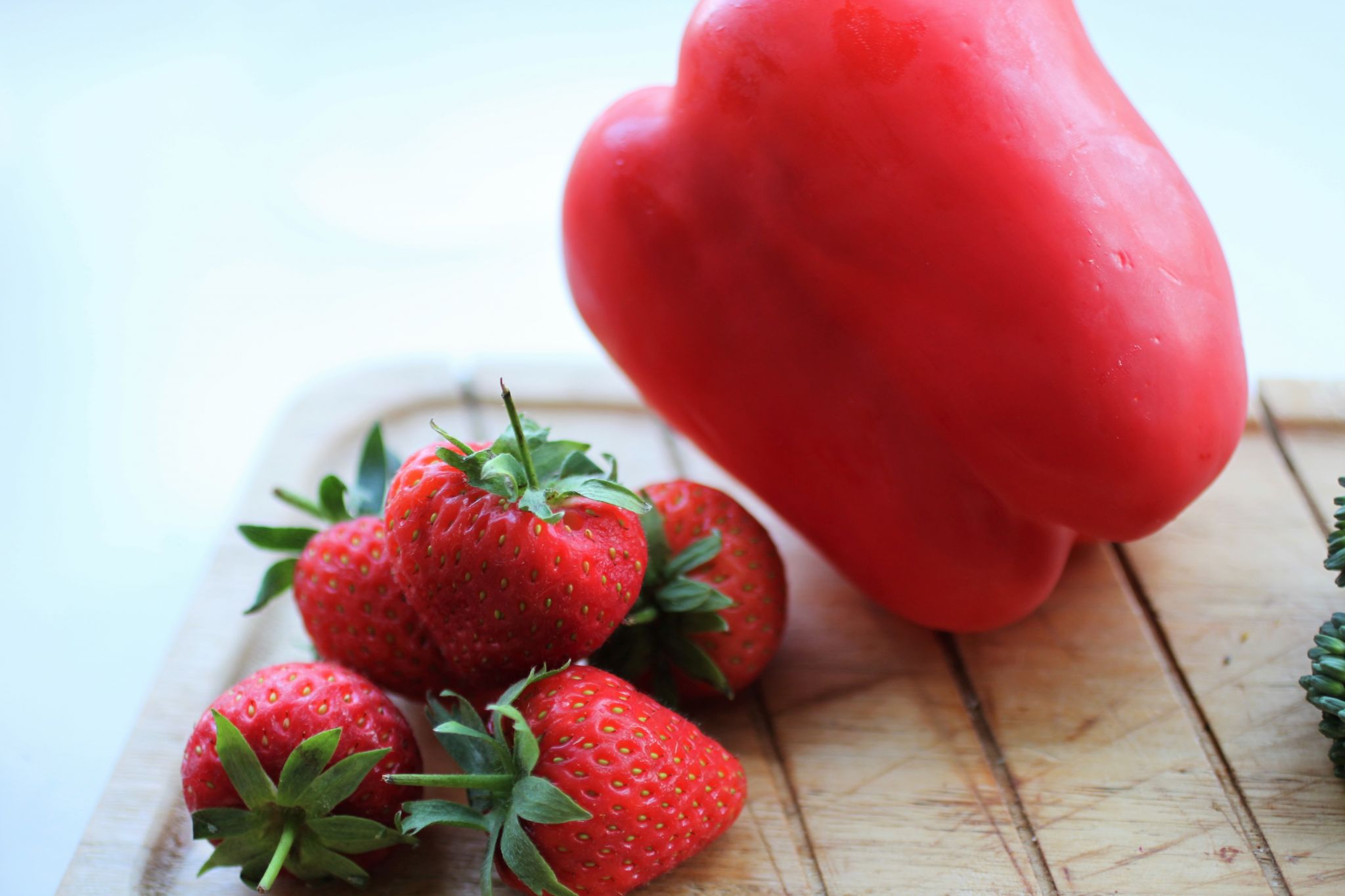 eat the rainbow -a tray with a red pepper and some strawberries 