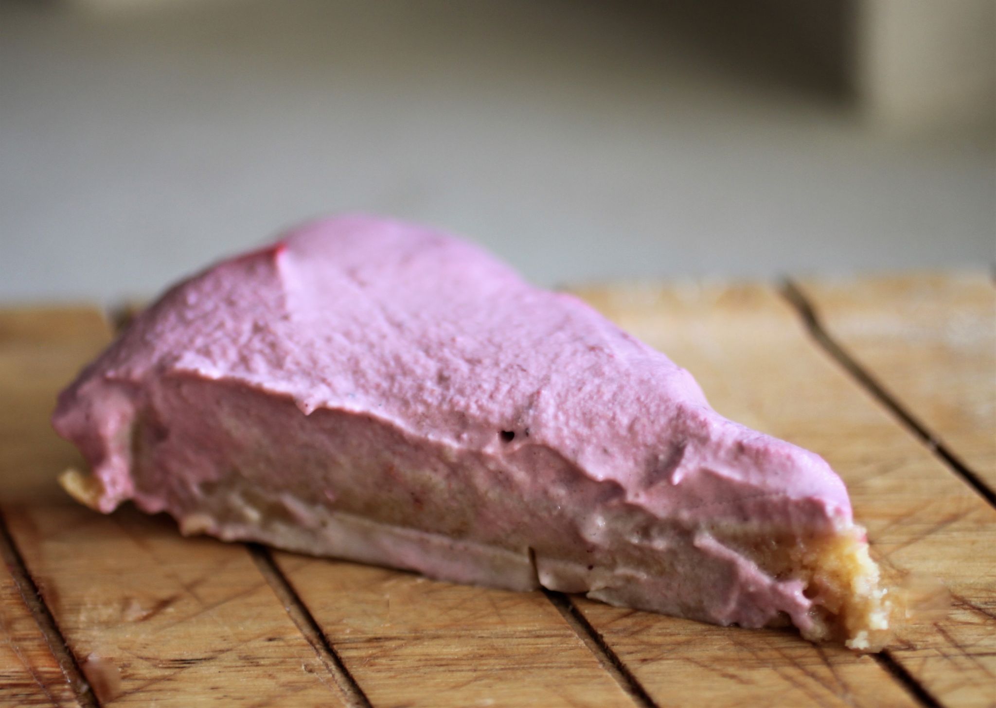 vegan strawberry cheesecake slice on a tray