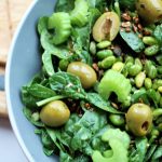 avocado edamame salad in a large bowl placed on a wooden board