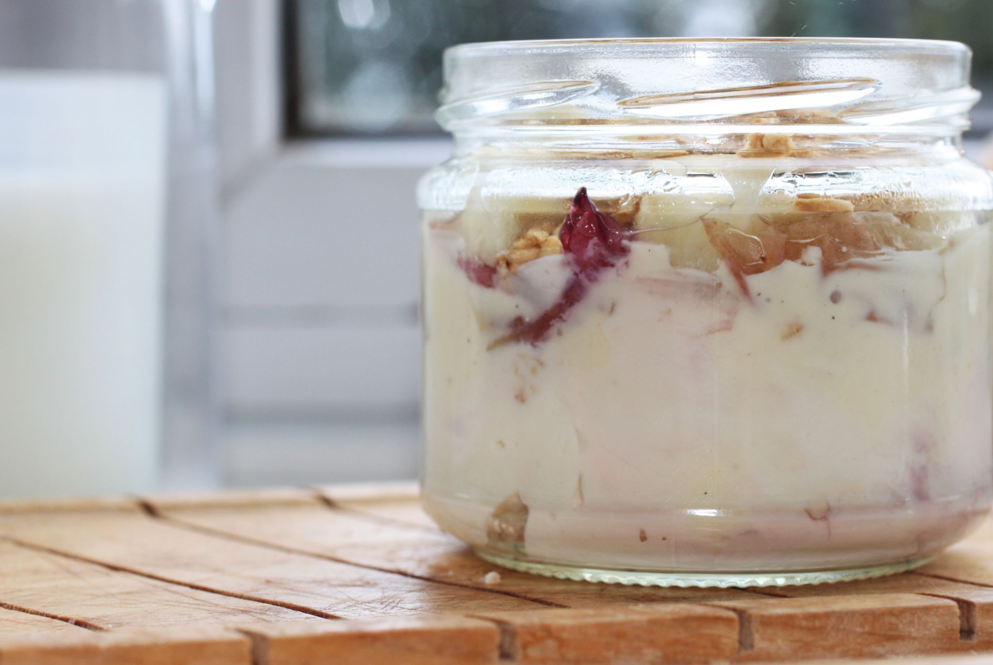nectarine parfait in glass jar, close up