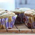 muffins on a wooden tray, shot level from the side.