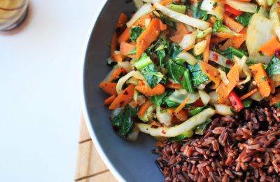 simple veggie stir fry recipe with red rice served in large pasta bowl