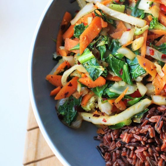 simple veggie stir fry recipe with red rice served in large pasta bowl