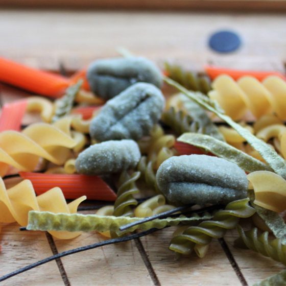 uncooked gluten free pastas spread out on a tray