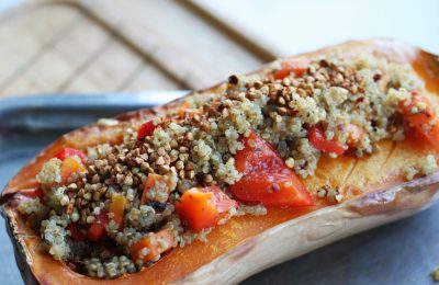 quinoa stuffed squash, cooked on a baking tray