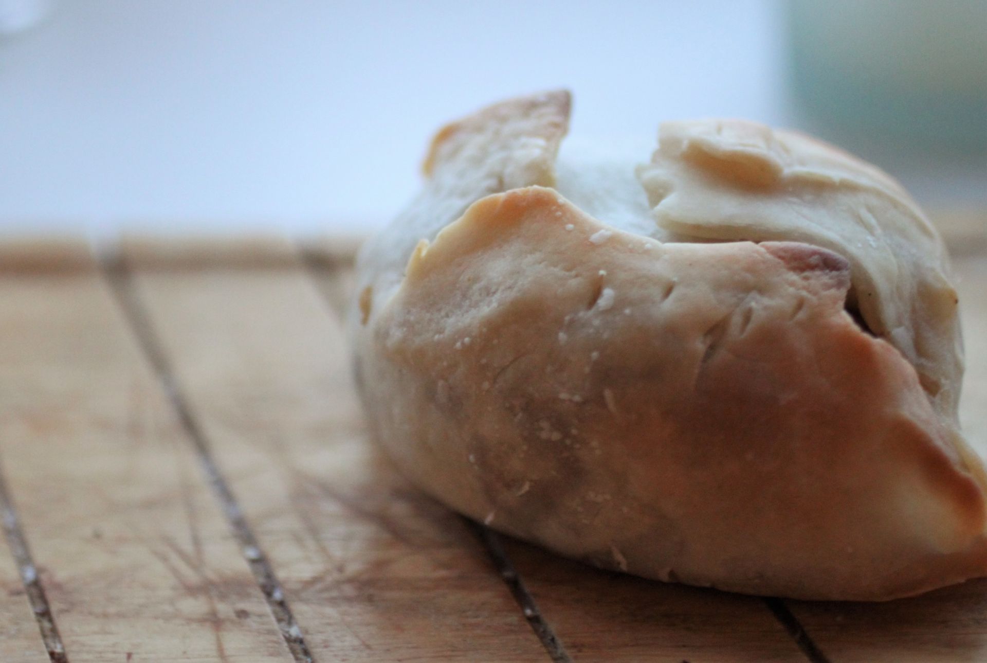 vegan christmas pastry parcel on a wooden tray