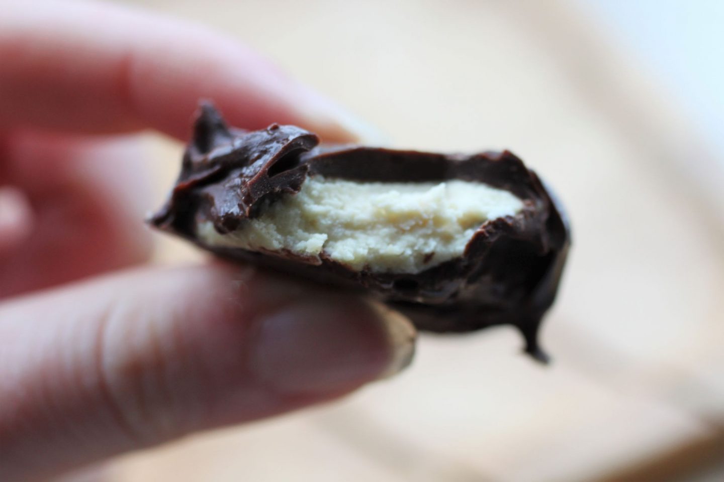 vegan peppermint cream bitten into to show the inside