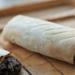 gluten free vegan sausaage rolls on a wooden tray