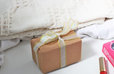 a small cardboard box tied with ribbon