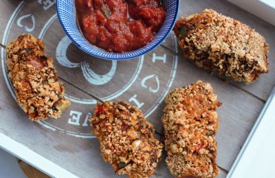 3 black bean veggie dippers on a grey wooden tray with a pot of salsa
