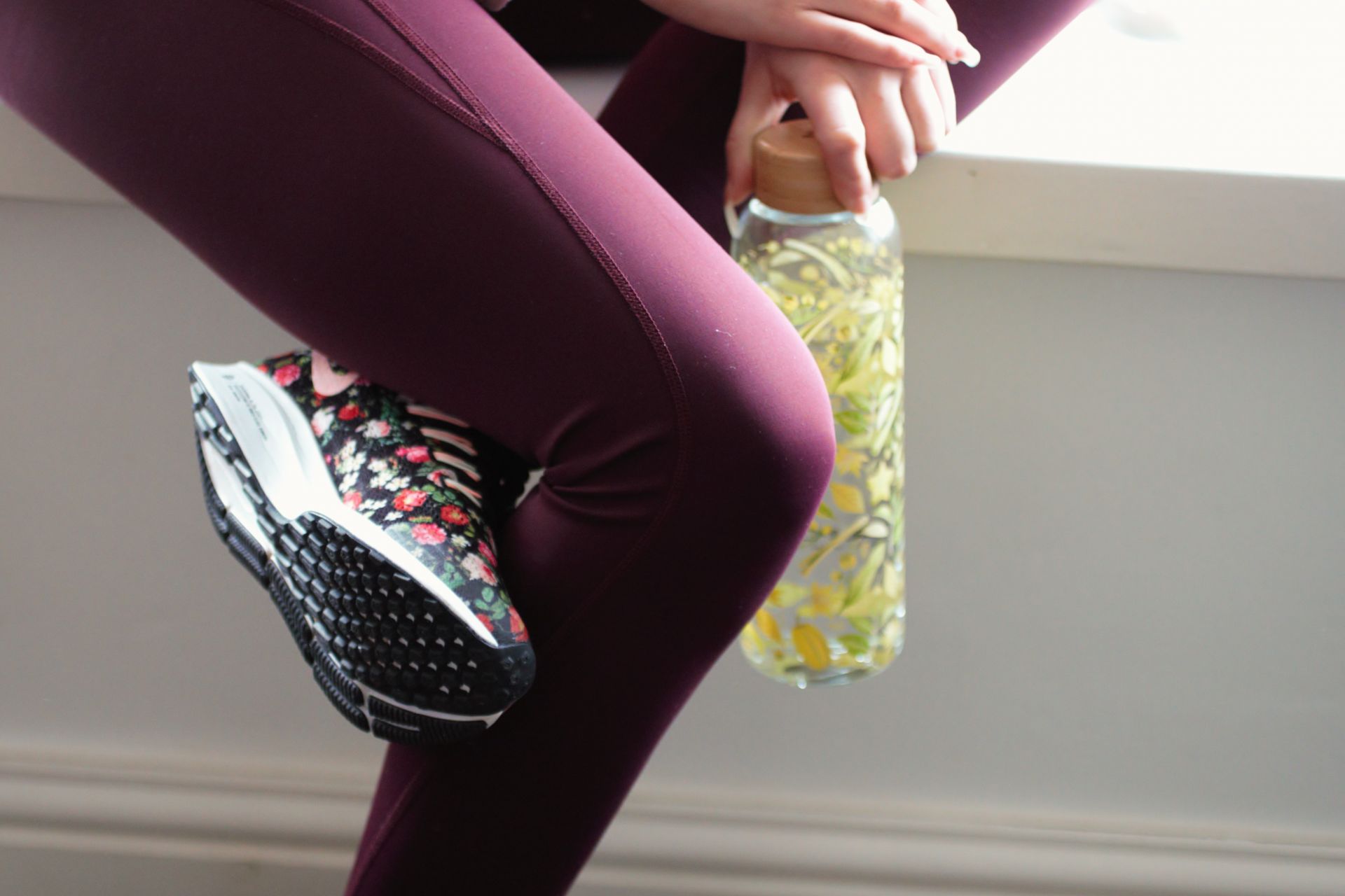 picture of the lower half of my body wearing gymwear and carrying a water bottle, ready for a home workout.