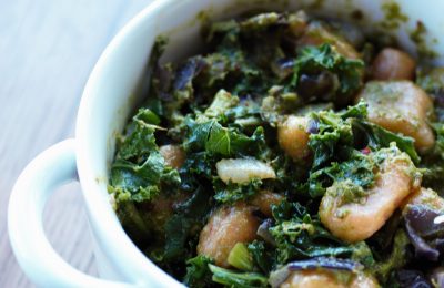 garlic kale gnocchi in a white bowl