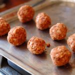 small bean meatballs on a bakig tray to show appropriate size