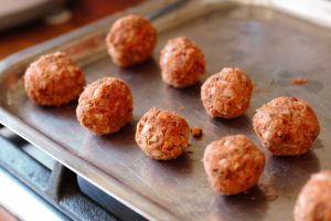 small bean meatballs on a bakig tray to show appropriate size