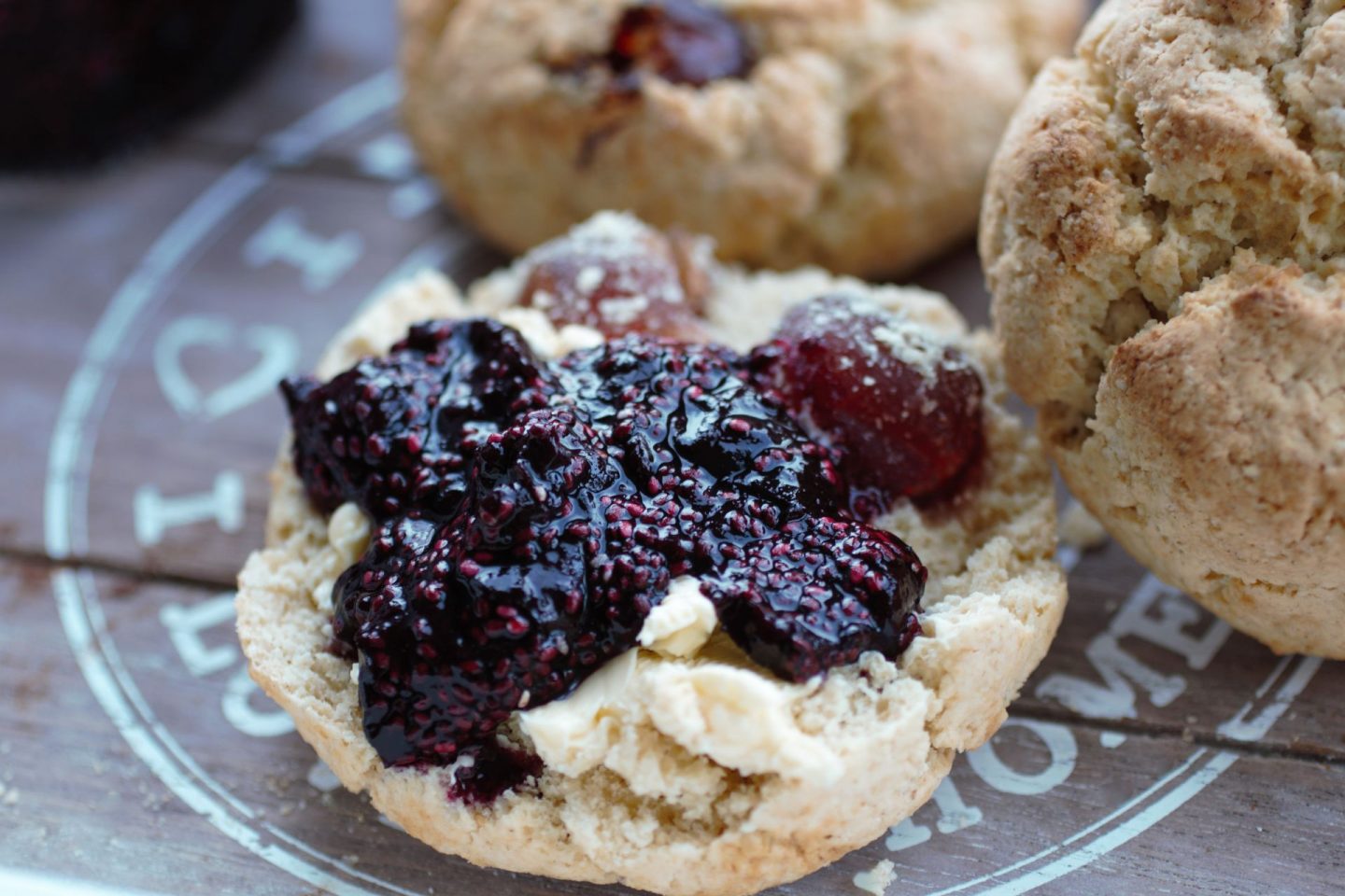 gluten free vegan cherry scones sliced open and topped with cherry compote