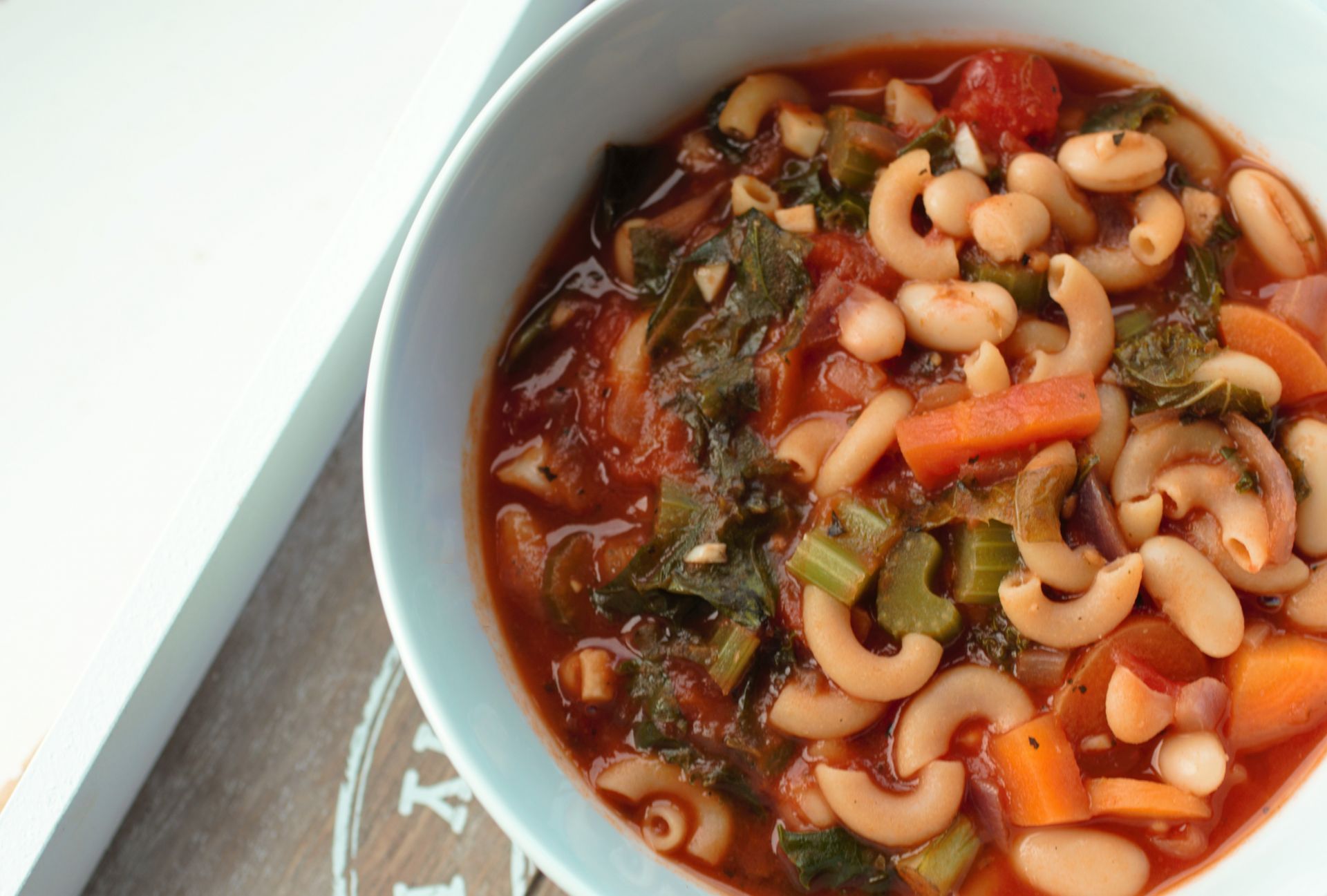 minestrone soup in a white bowl