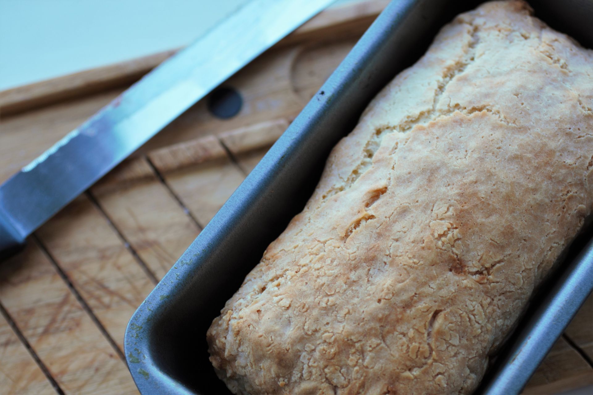 loaf of gluten free bread in a loaf tin