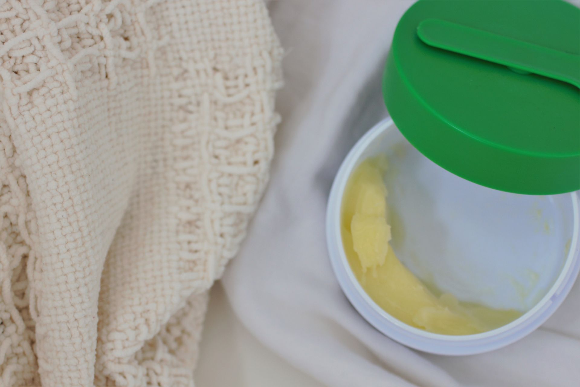 nearly empty drunk elephant cleansing balm pot