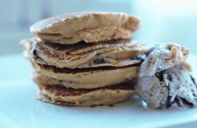 stack pf peanut butter choc chip pancakes on a white plate