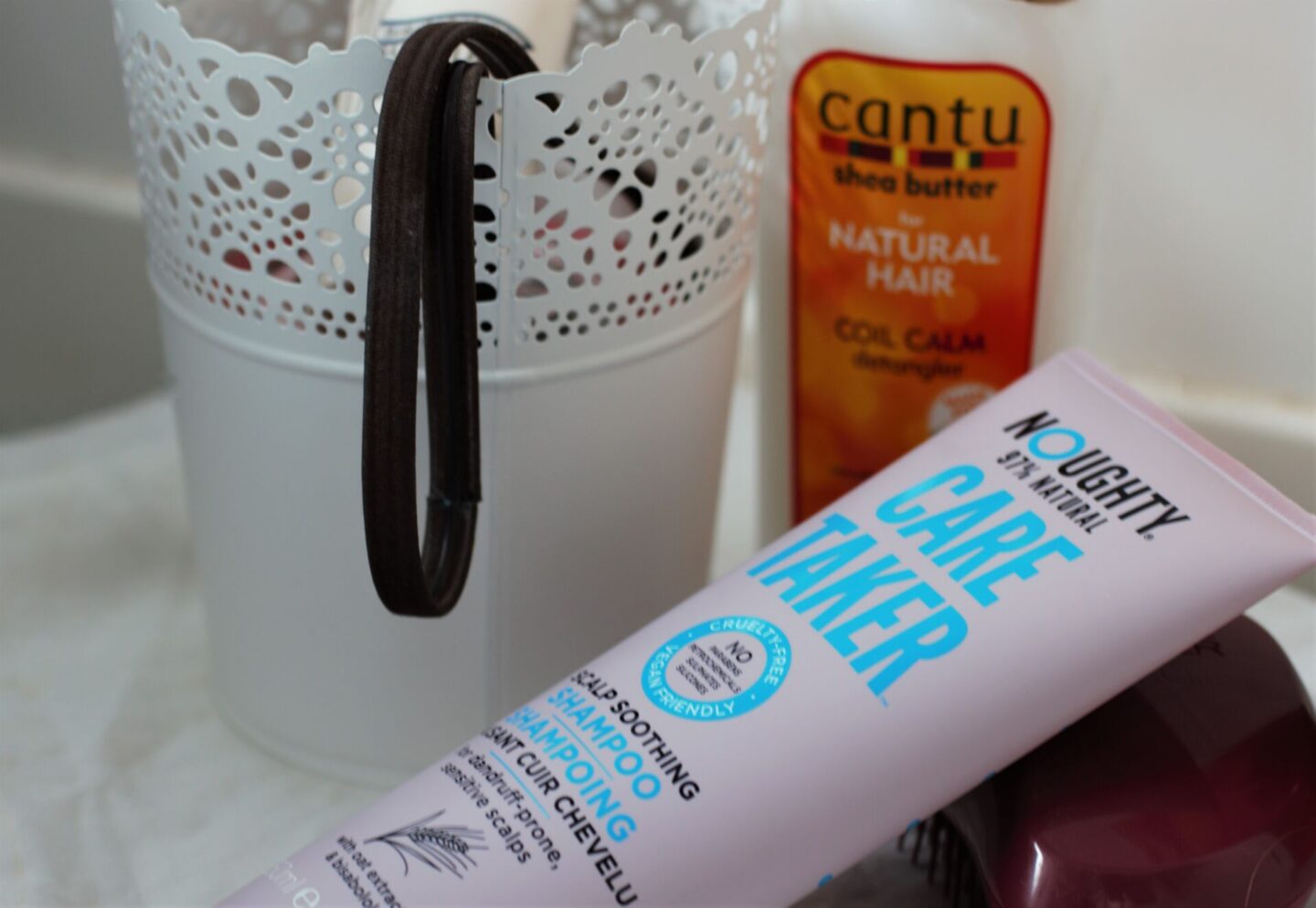 a couple of curly girl haircare products I picked up, placed in my bathroom