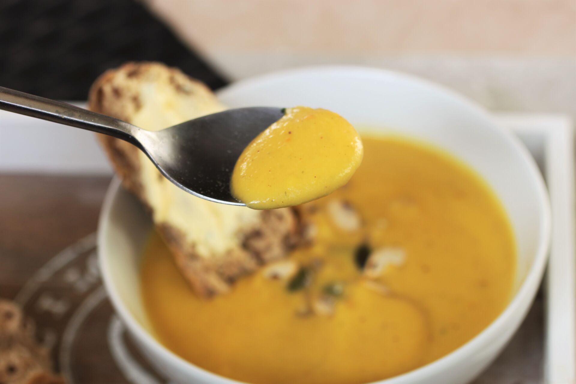 close up of a spoon of soup