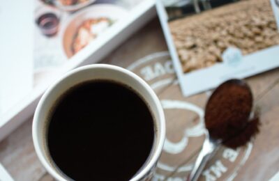 mug of coffee on a grey tray with a coffee card