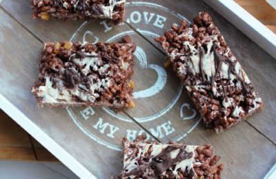 chocolate orange rice krispie squares bars on a grey wooden tray