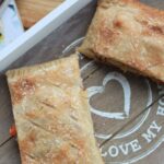 2 slices of leftovers pastry on a wooden board