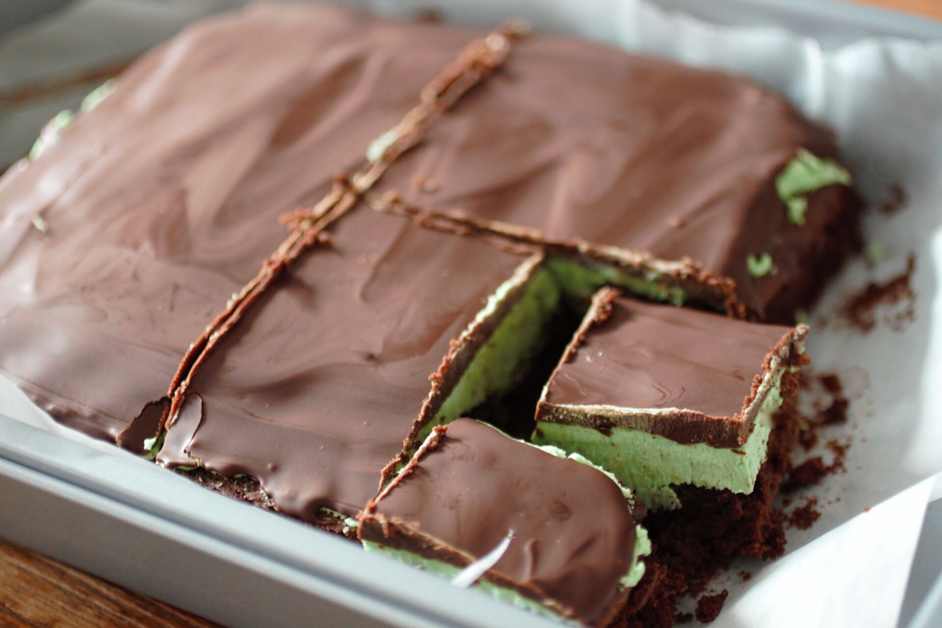 tray with batch of sliced brownies in