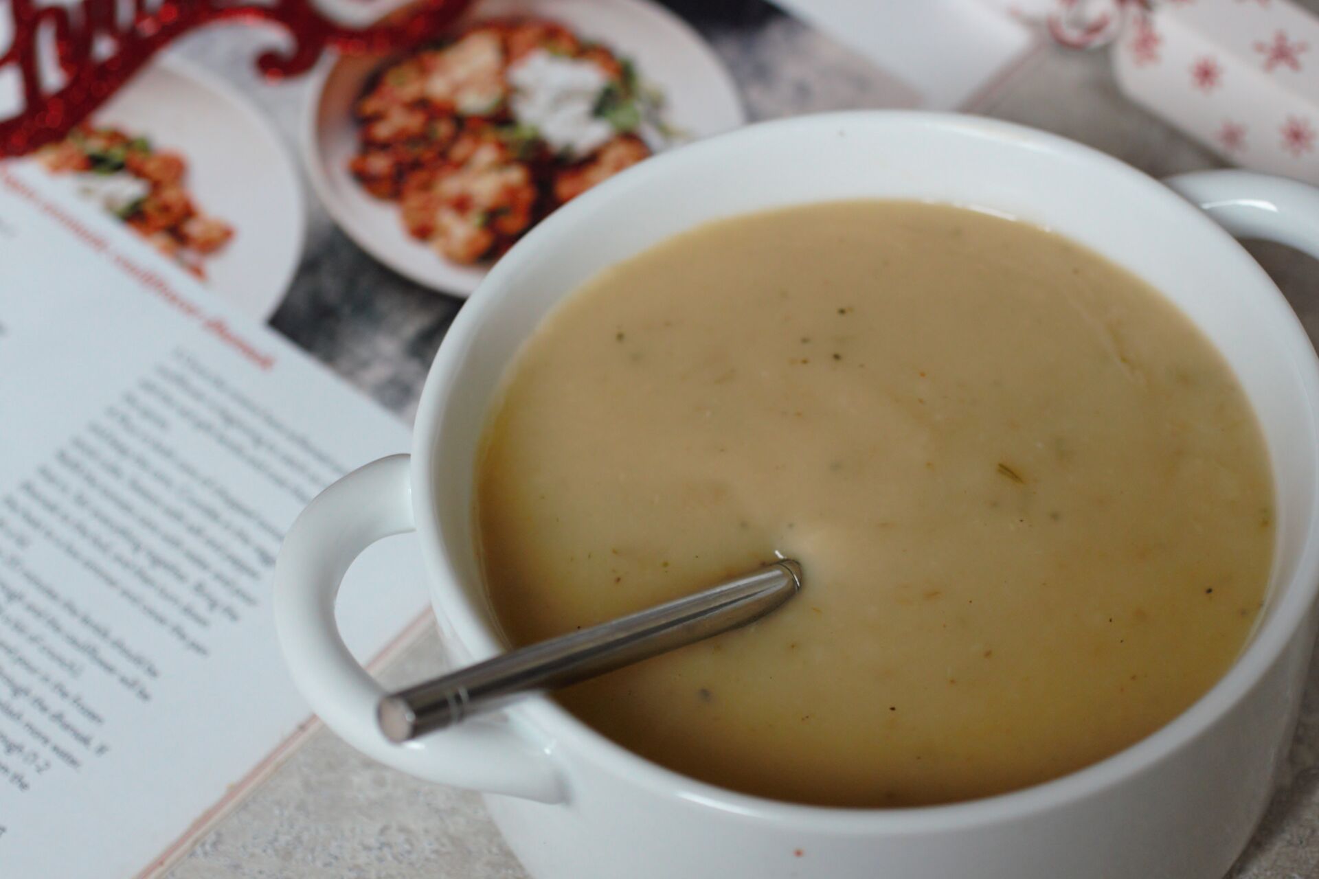close up of the soup bowl with a spoon in it