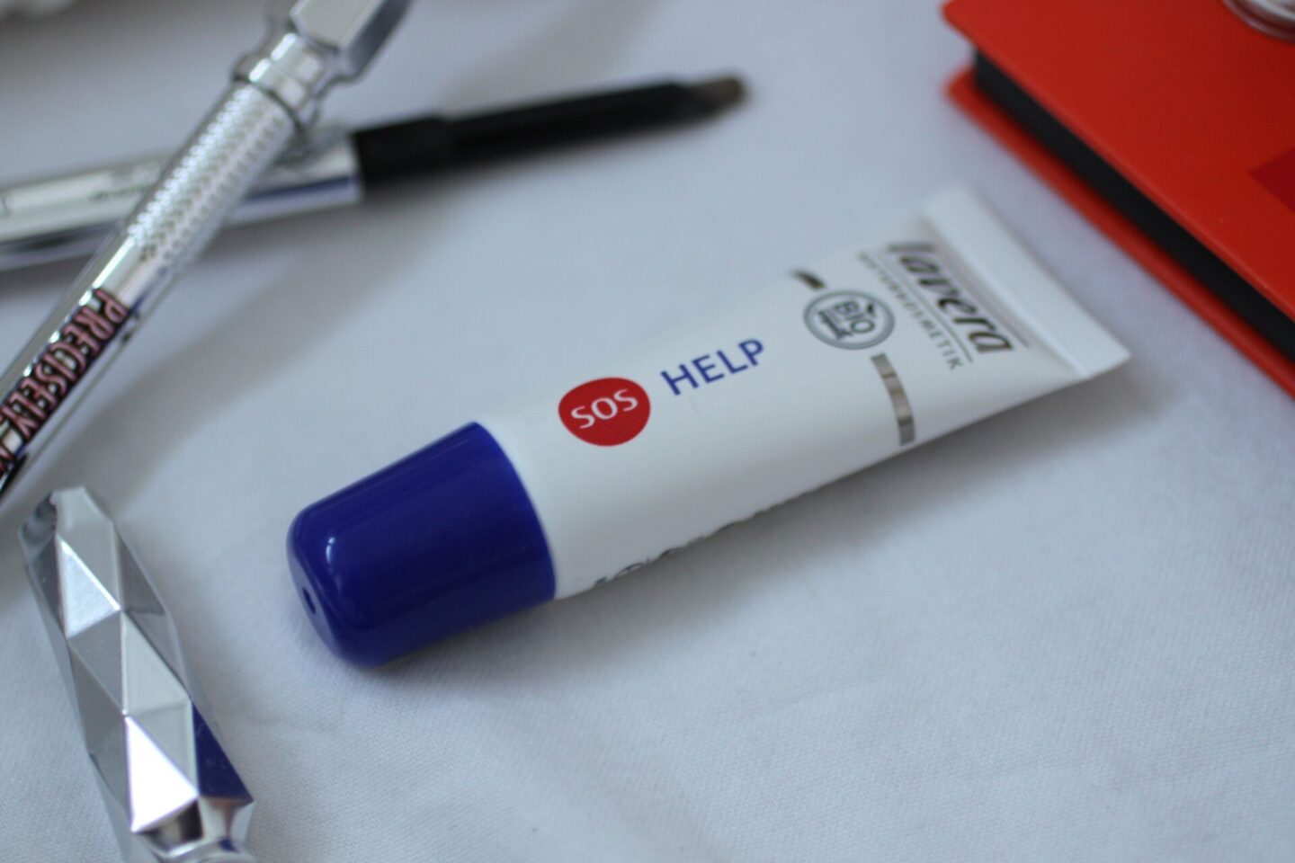 Lavera lip balm on a white sheet