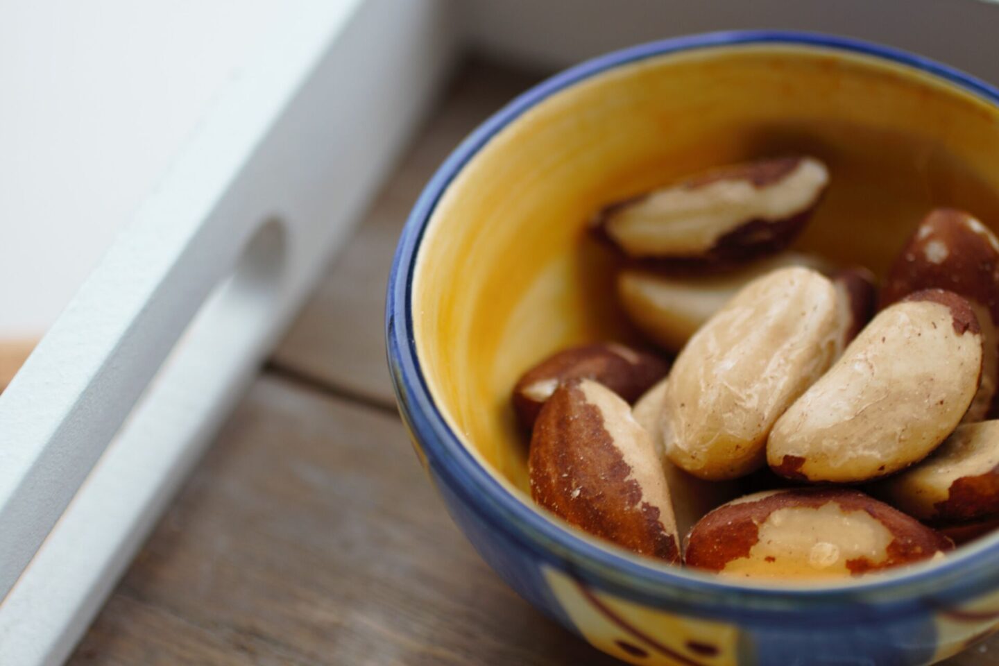 brazil nuts - the best source of selenium in a small ceramic dish