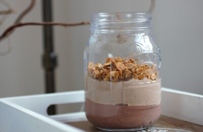 peanut protein breakfast pot on a tray against a white wall