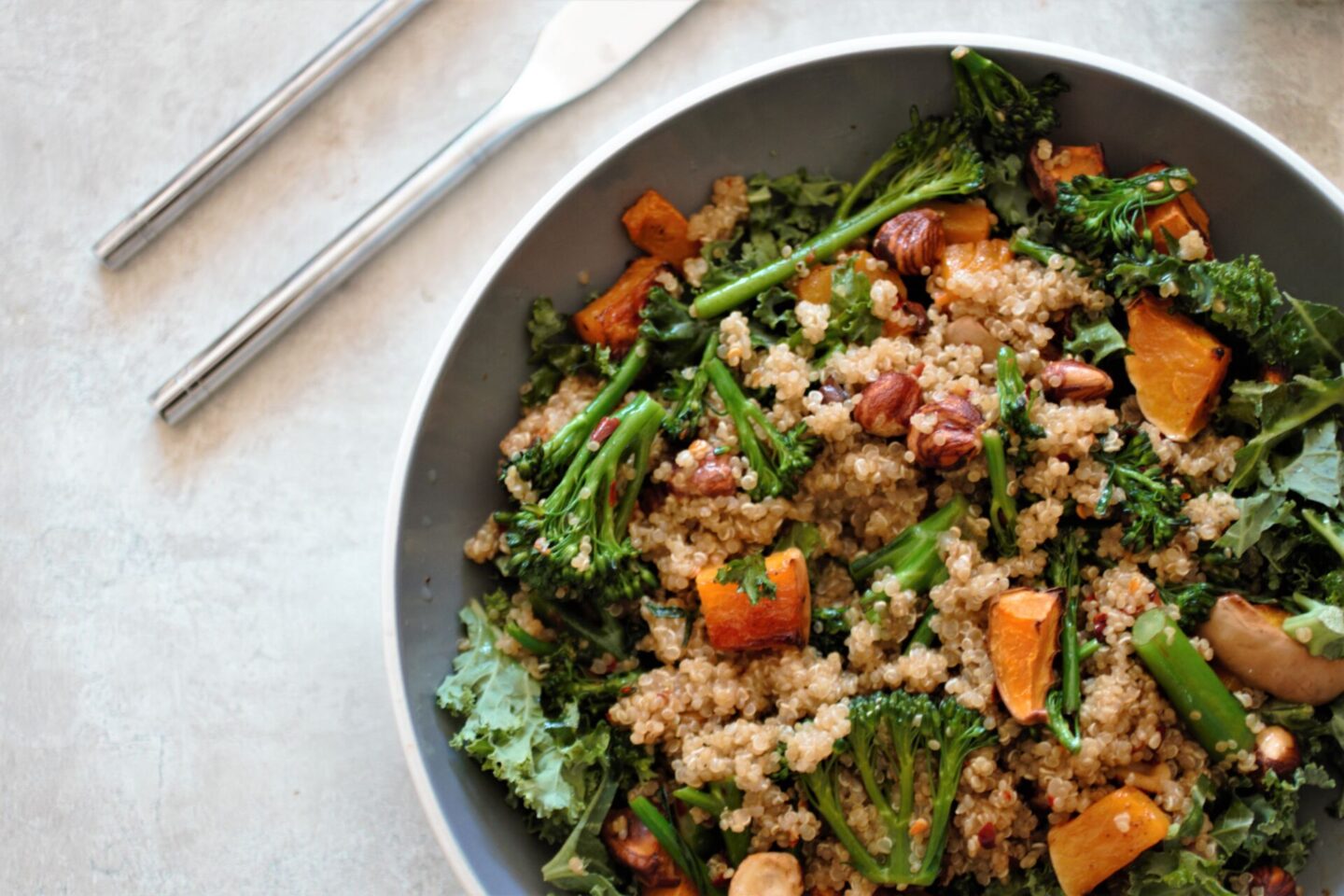 grey pasta bowl filled with maple squash salad recipe