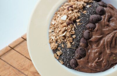 mocha smoothie bowl recipe in a bowl topped with granola and chocolate chips