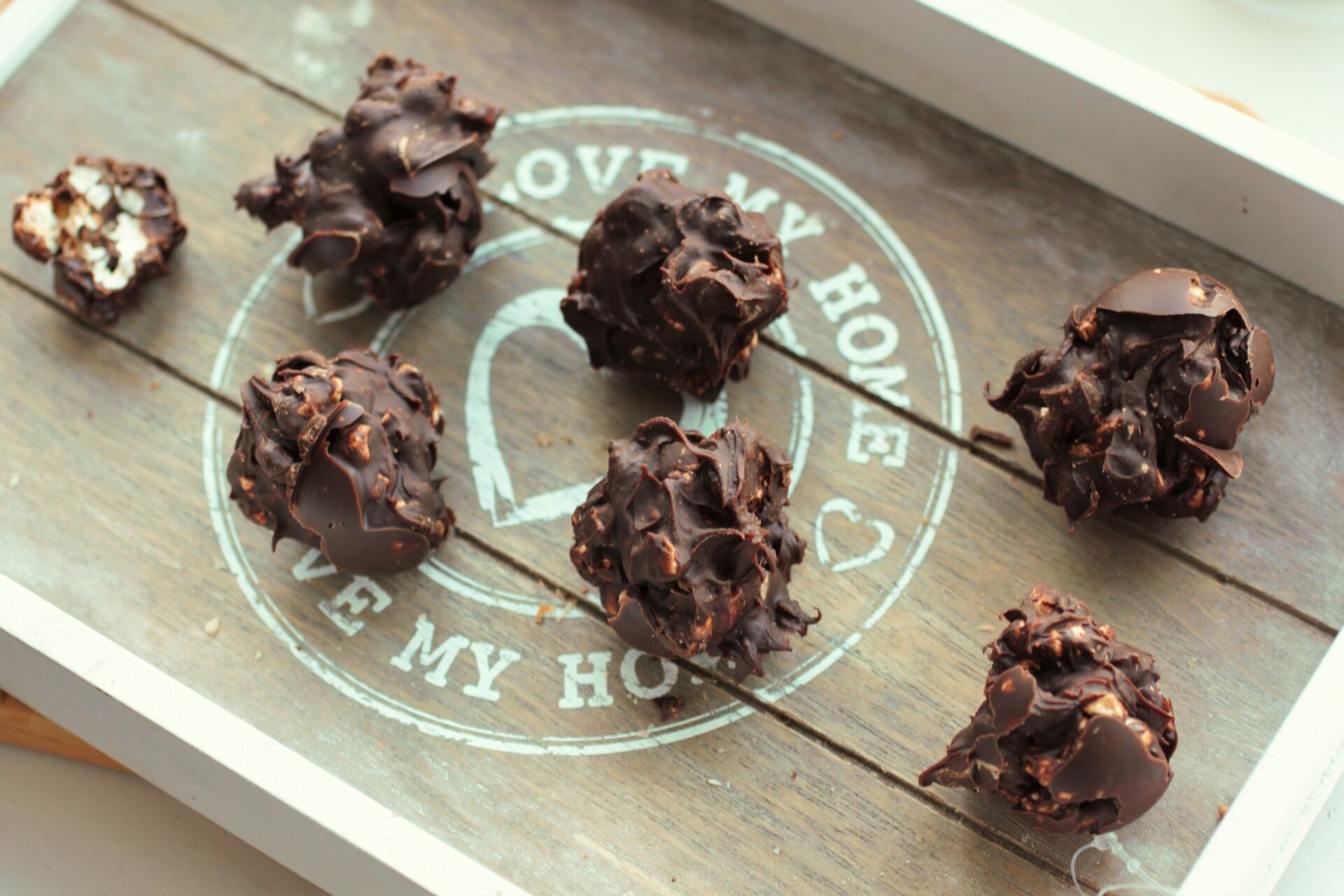 peanut butter popcorn balls recipe on a grey tray