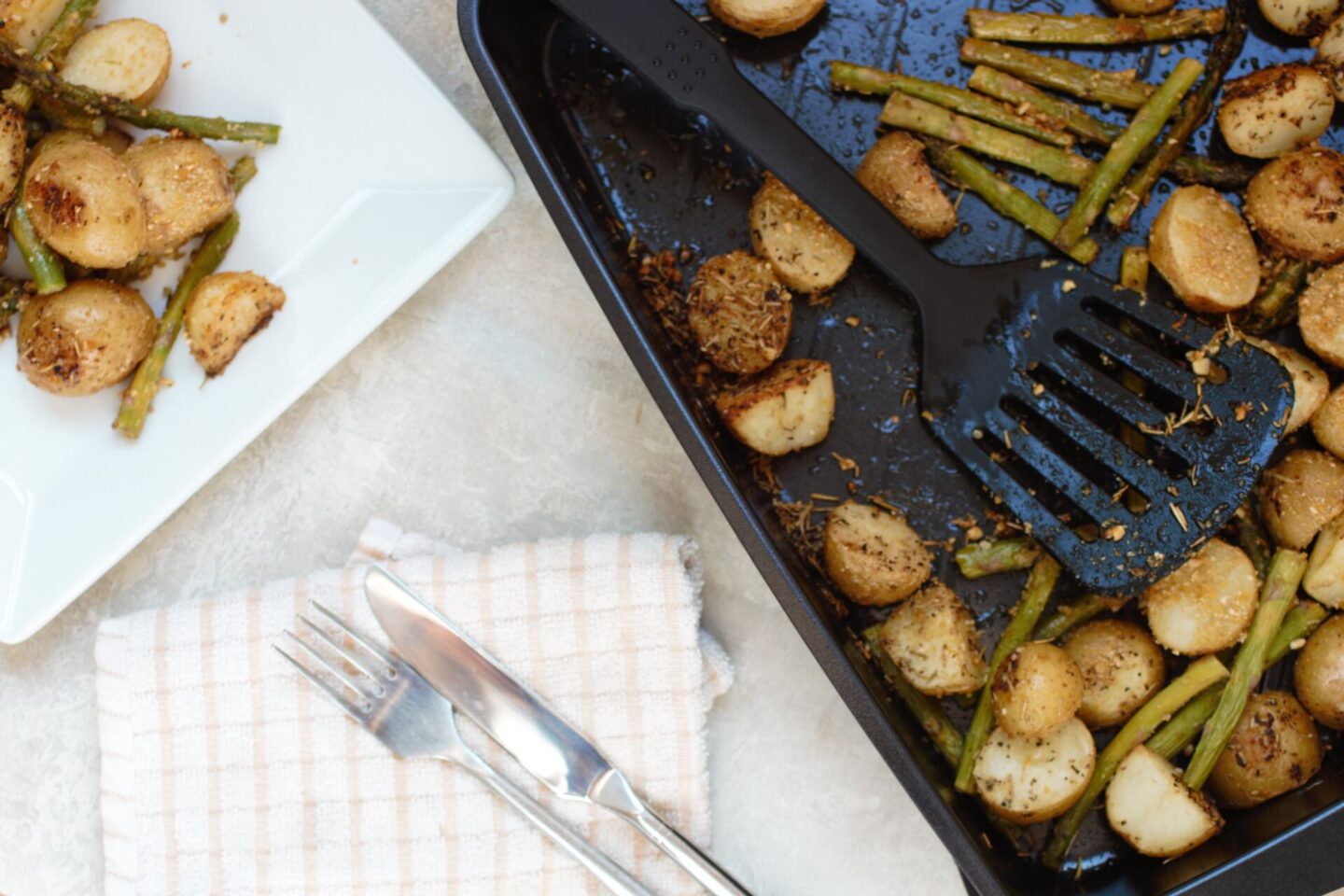 vegan lemon & herb potatoes recipe, a baking dish and plate with the cooked dish on
