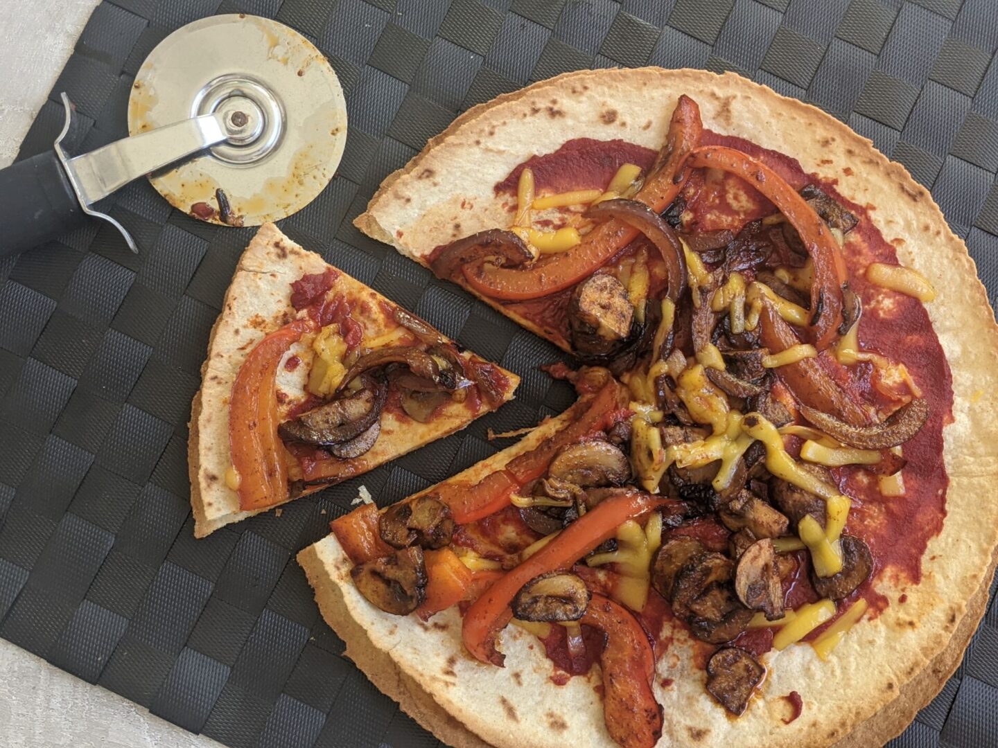 mexica tortilla pizza recipe - slice of cut pizza