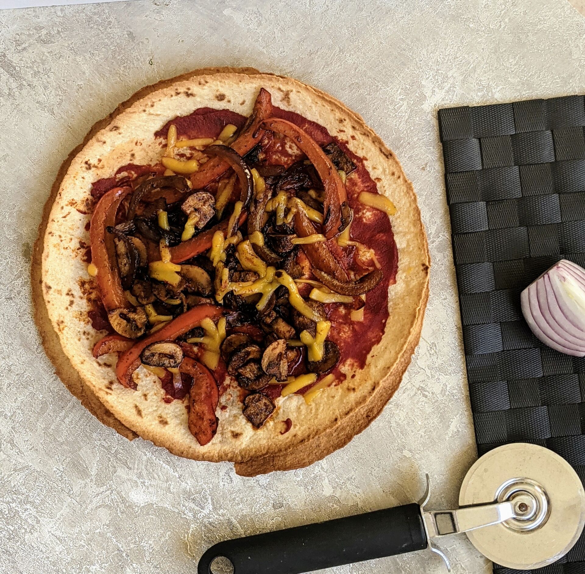 mexican tortilla pizza - whole, freshly cooked pizza