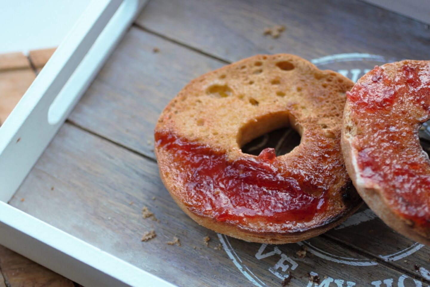 a toasted schar bagel on a tray