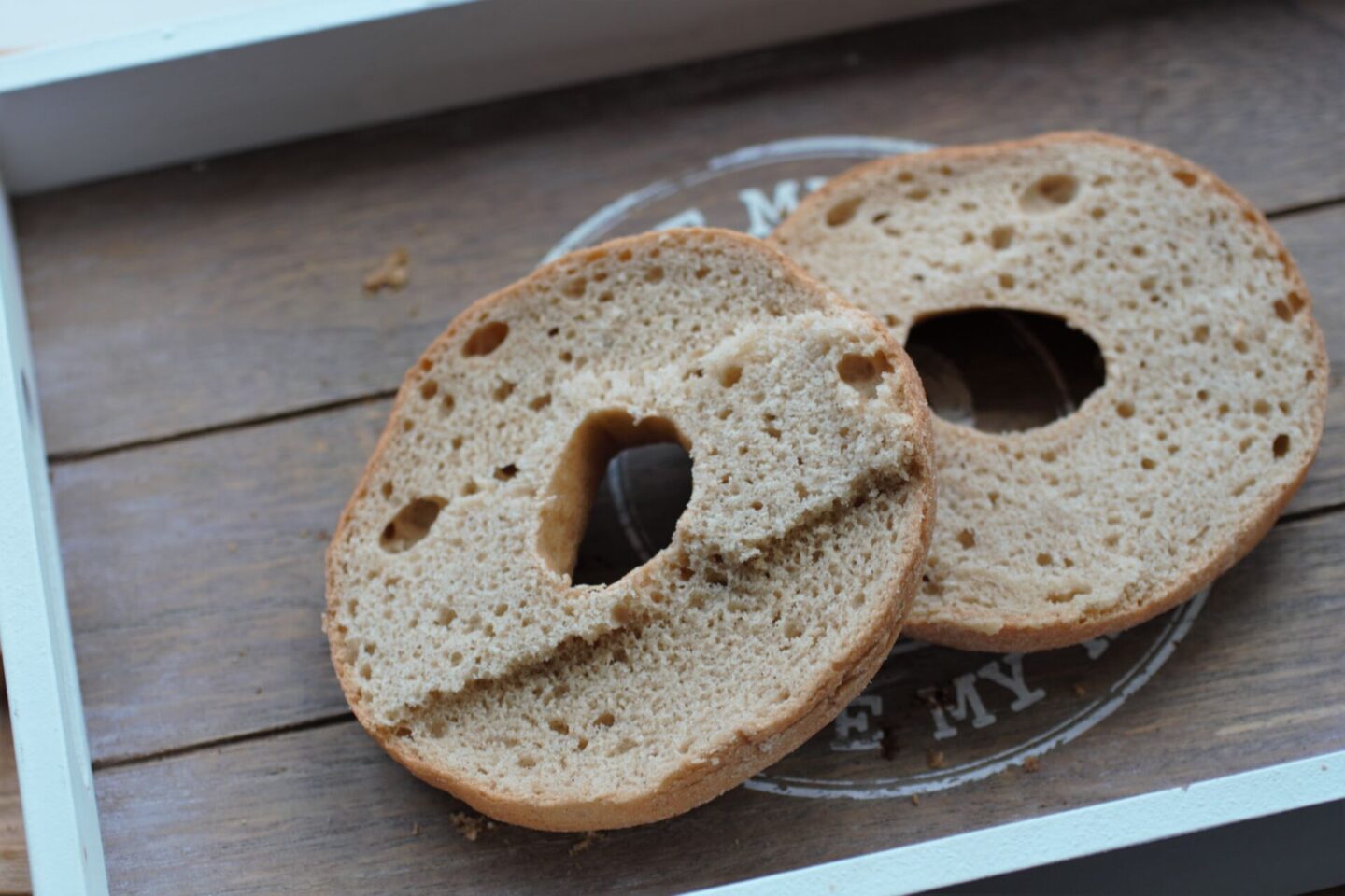 a schar gluten free bagel sliced on a tray