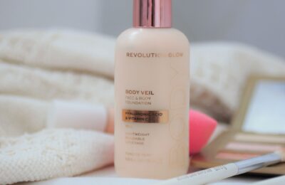 Revolution Veil Face & Body Foundation bottle and some other makeup