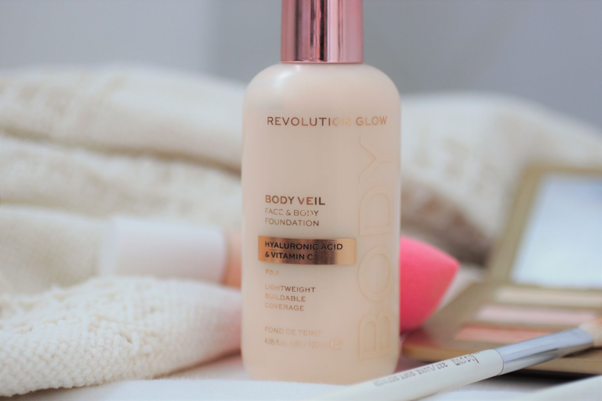 Revolution Veil Face & Body Foundation bottle and some other makeup
