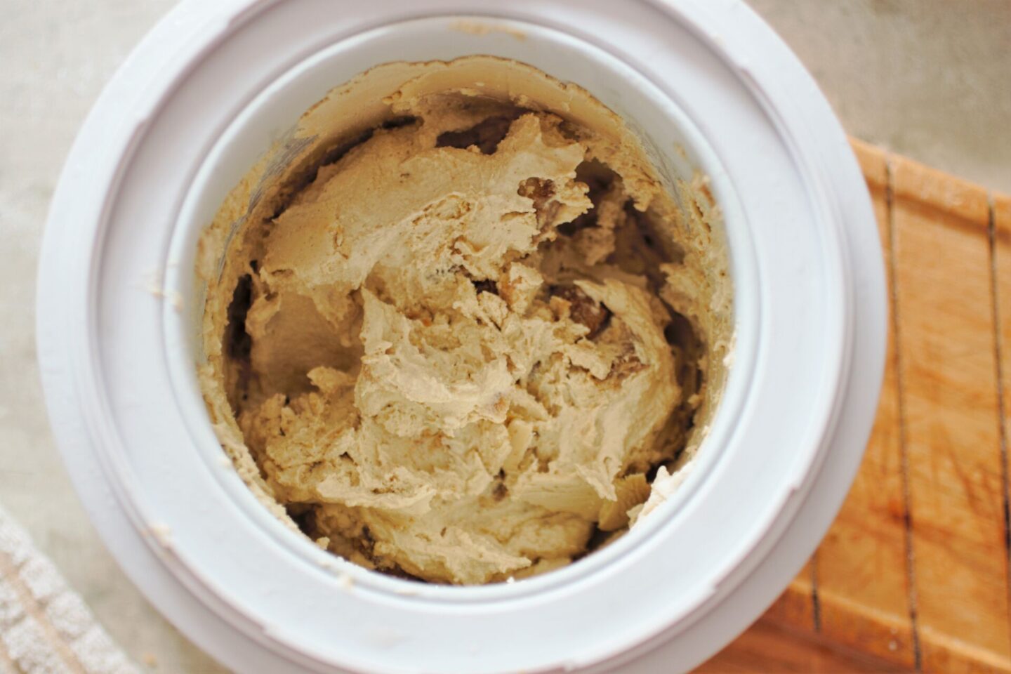 the ice cream maker with the finished cookie dough ice cream in it