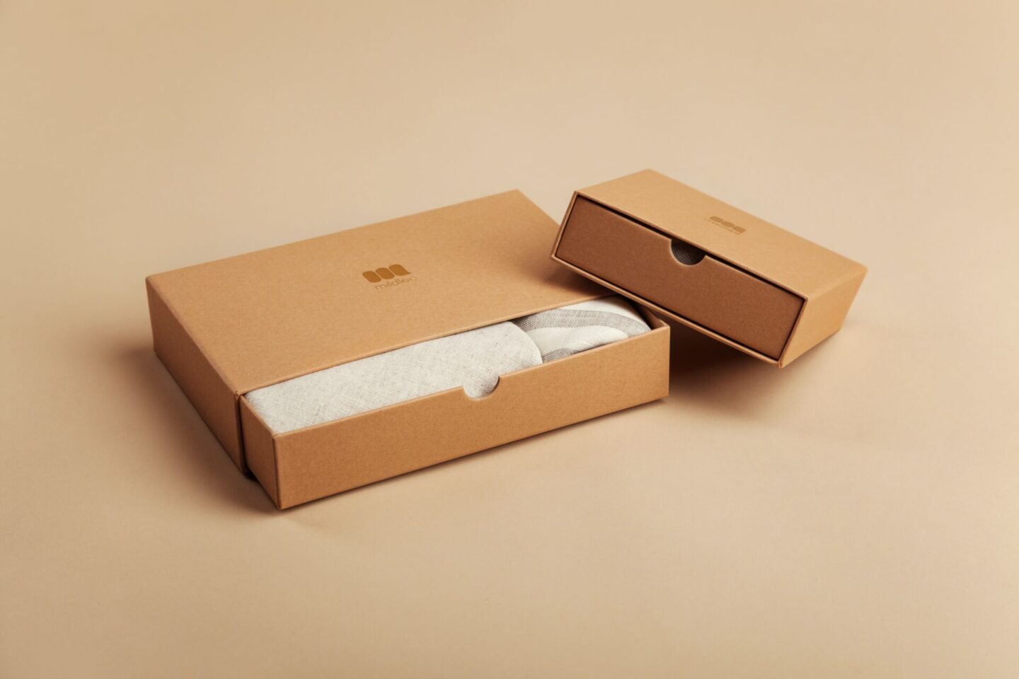 how to online shop more sustainably - a picture of brown cardboard recyclable packaging